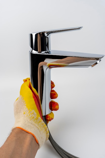 New shiny sink faucet on a white background Sink mixer