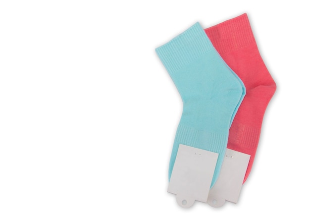 New socks on a white background. Colorful socks with beige label for your design. Isolated object.