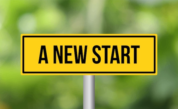 A new start road sign on blur background