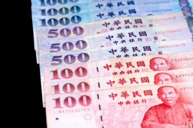 new taiwan dollar banknote, cash isolated on balck backbround