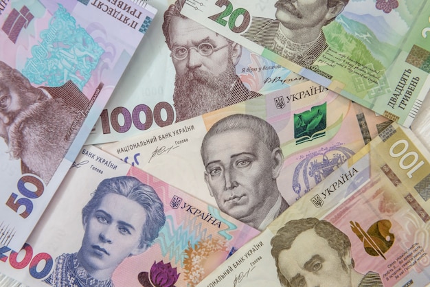 New ukraine money banknotes as background for design. uah cash