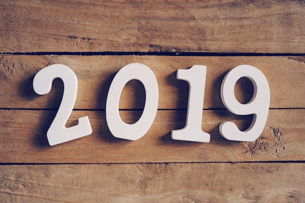 Photo new year 2019 word on wooden table. business concept.