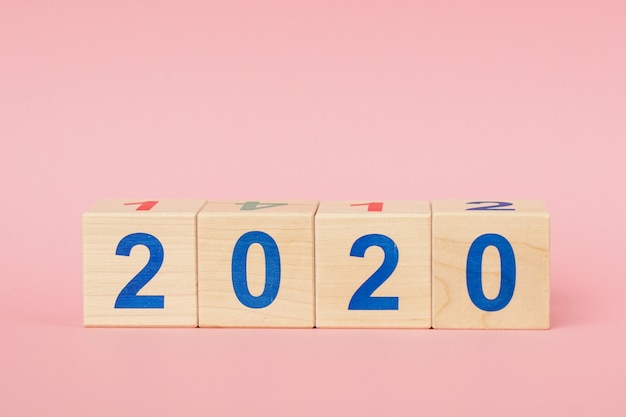 Photo new year 2020 concept. wooden block cube with number