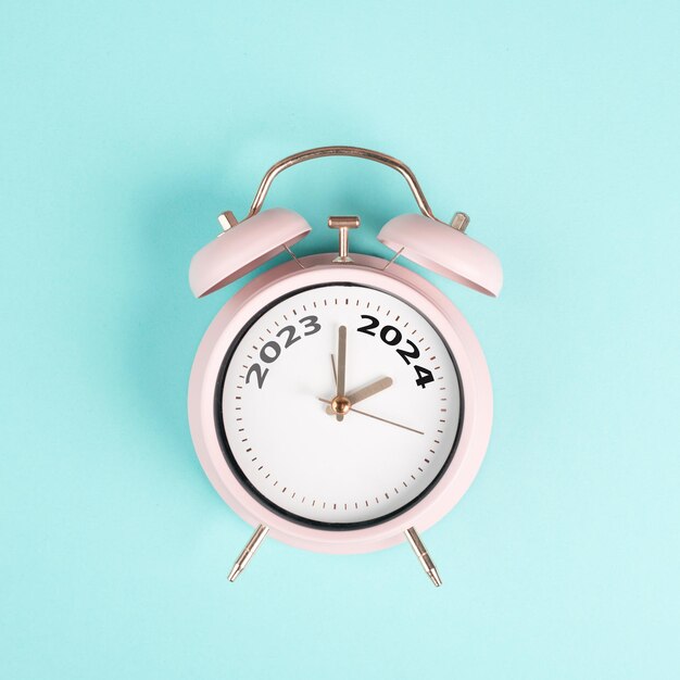 Premium Photo New year 2024 is loading calendar date on an alarm