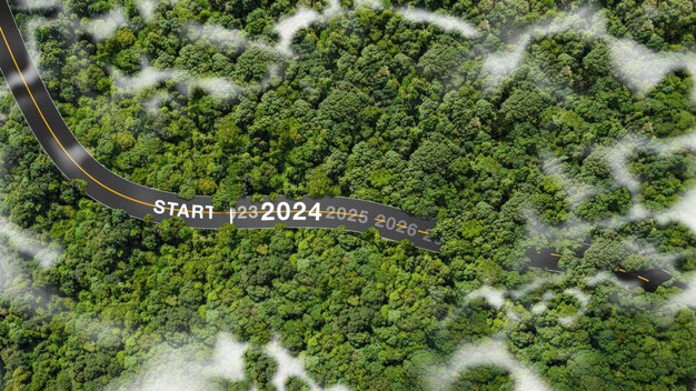 Foto i numeri del nuovo anno 2024 sui pneumatici stradali concetto di pianificazione obiettivi sfide celebrazione ambiente 2024 vista dall'alto vasta foresta naturale
