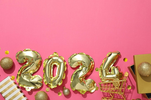 New Year 2024 with golden balloons with gifts