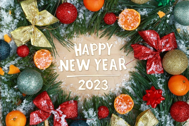 New Year card cover Text Happy New Year 2023 and a frame made of different decor