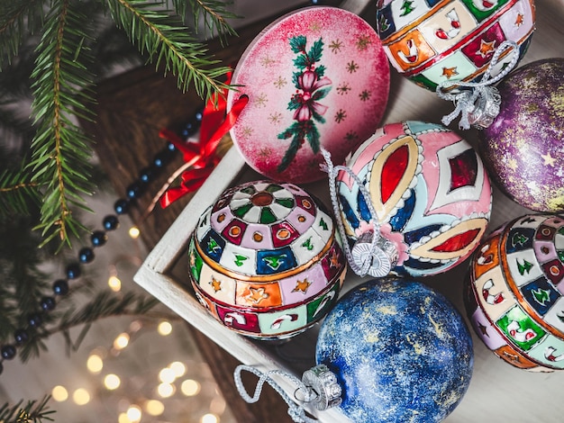 New Year and Christmas balls lie on the table