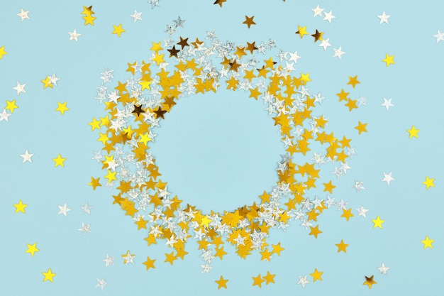 New Year Christmas or Birthday background Scattered holiday confetti stars and glitter