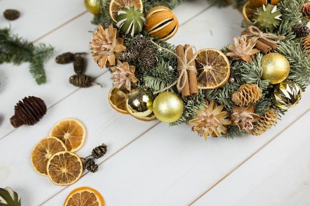 New year christmas decoration with spices, cinnamon, mandarin, eve on white wooden background