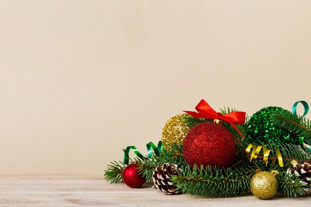 New Year Christmas tree toy branches of a christmas tree New Year decorations on a colored background