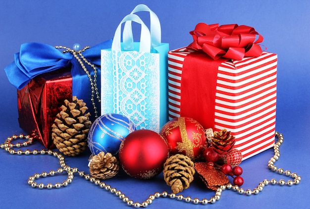 New Year composition of New Year's decor and gifts on blue