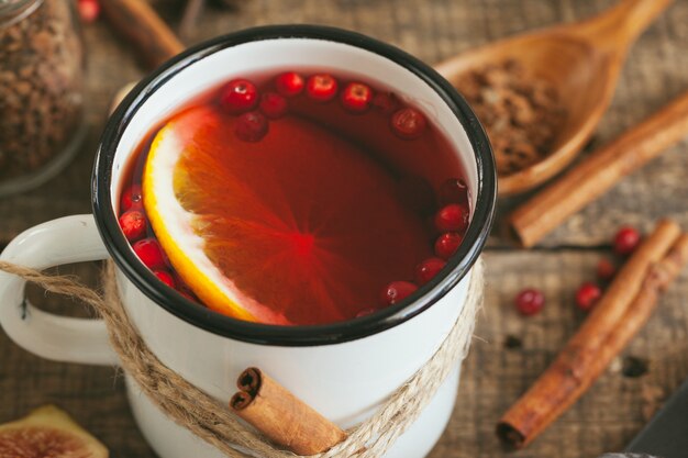 New Year composition with mulled wine on dark wooden surface  