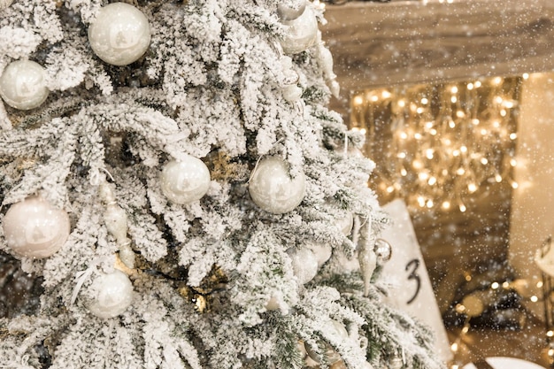 New year cozy home interior with christmas tree and garlands