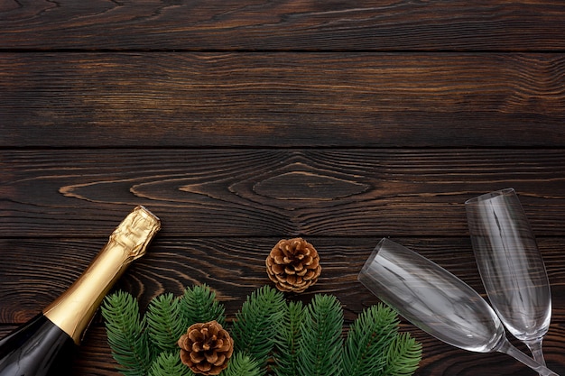 New Year decoration with champagne bottle and fir branches