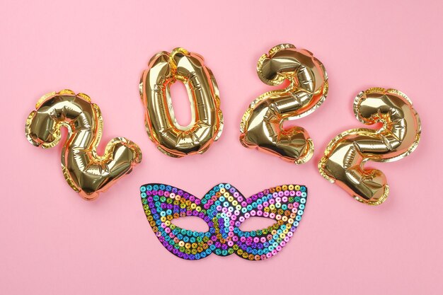 New year  foil balloons numbers  on pink background new year christmas