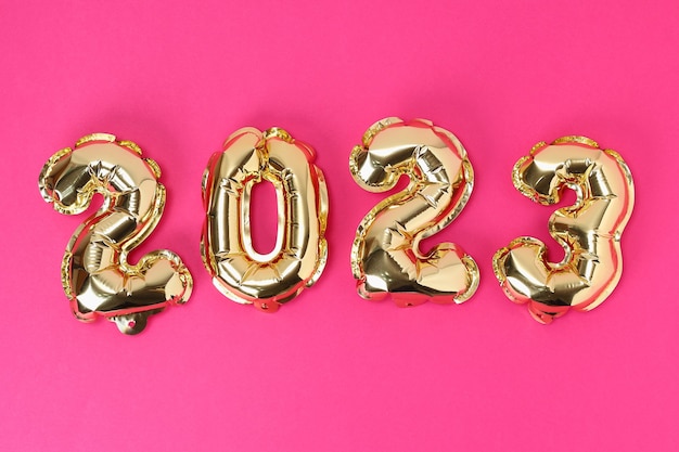 New year  foil balloons numbers  on pink background new year christmas