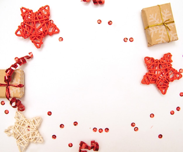 New year gifts. Christmas background.Packed gifts and stars on a white background are in the form of a circle.