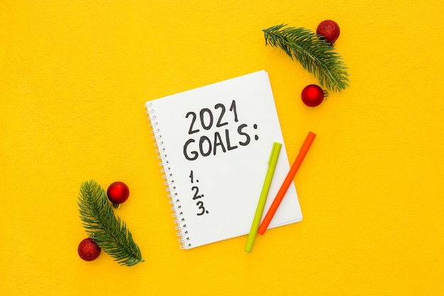 New year goals list Christmas decorations and notebook isolated