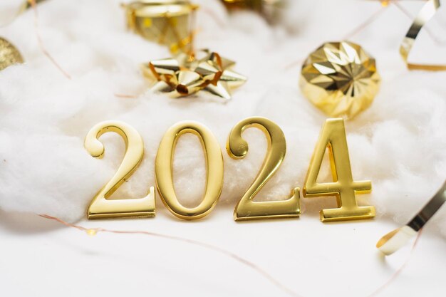 Photo new year holiday background golden numbers 2024 with bright glowing lights