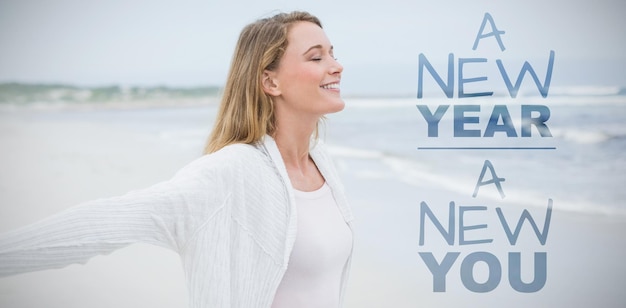 Photo new year new you against casual young woman with eyes closed at beach