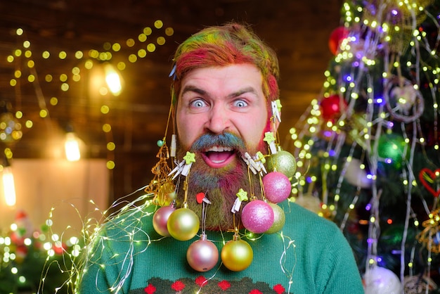 New year party merry christmas and happy new year cheerful santa man with decorated beard decorated