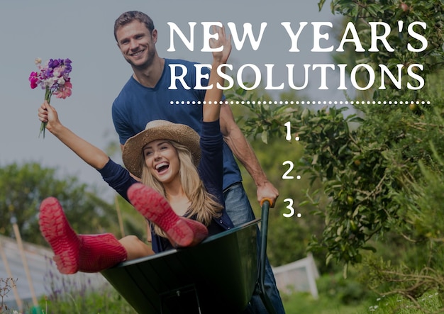 Photo new year resolutions against couple enjoying with wheel barrow