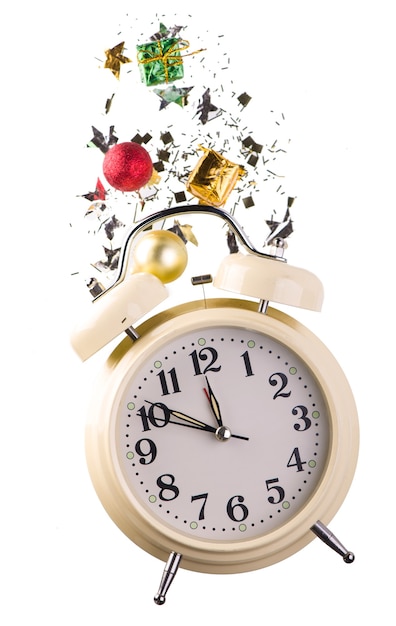 New Year retro alarm clock with festive decorations - stars, confetti, balls and gift boxes