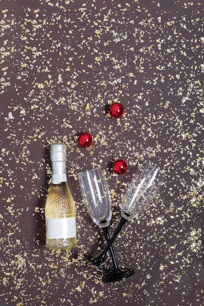 New Year's background with champagne bottle glasses and Christmas decorations