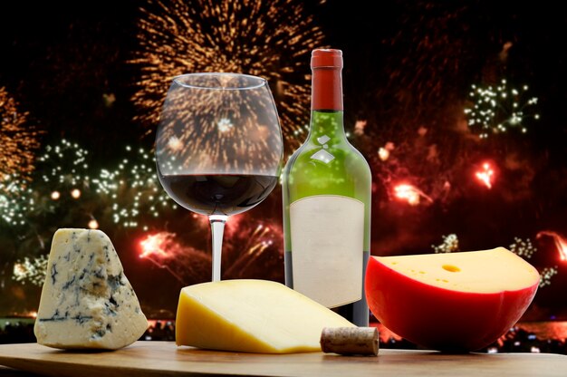 New Year's celebration with fireworks, red wine and special cheeses