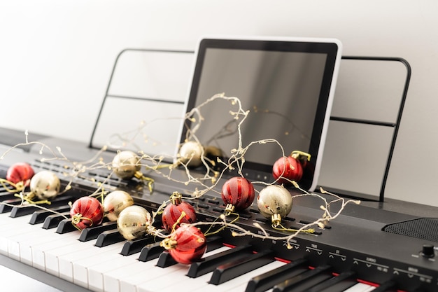 New Year's composition on a musical synthesizer. lights of a garland. Merry Christmas greeting card. Happy New Year.