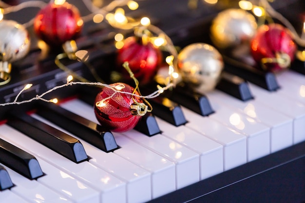 New Year's composition on a musical synthesizer. lights of a garland. Merry Christmas greeting card. Happy New Year.