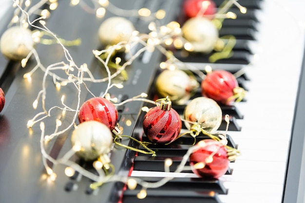 New Year's composition on a musical synthesizer. lights of a garland. Merry Christmas greeting card. Happy New Year.