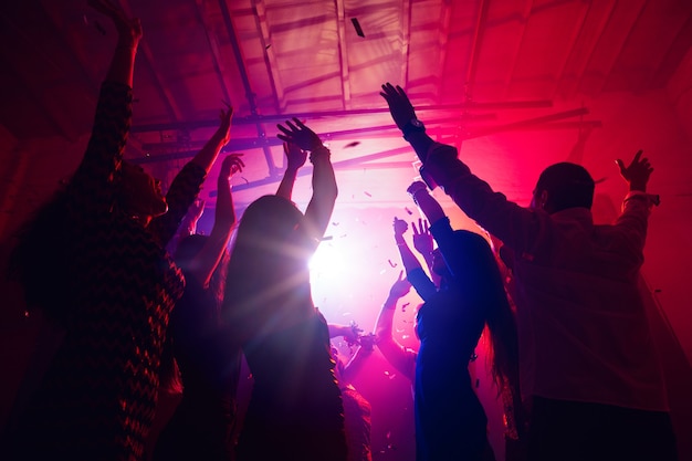 Premium Photo | Remember. a crowd of people in silhouette raises their ...