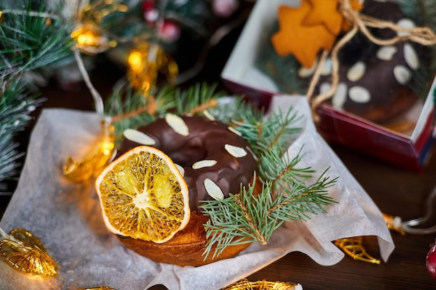 New Year's cupcake decorated with a dried orange slice and spruce branches