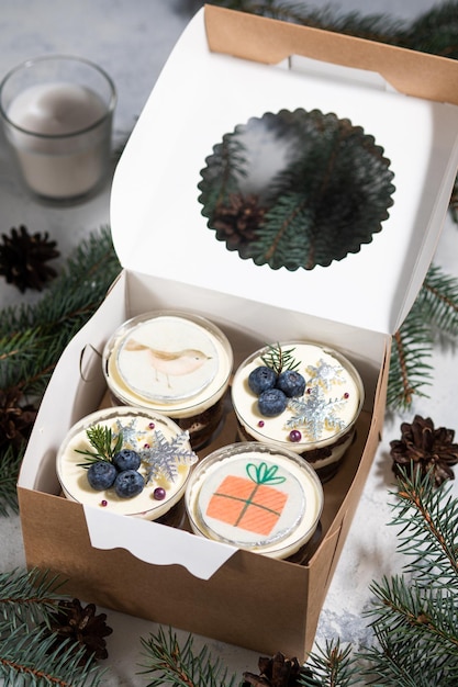 New Year's dessert made of biscuit, cream and berry and caramel filling. Christmas trifles in a box, to order.