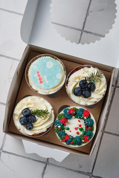 New Year's dessert made of biscuit cream and berry and caramel filling Christmas trifles in a box to order