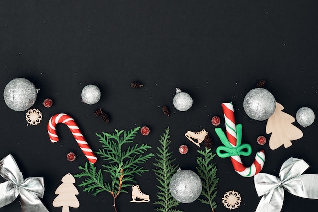 New Year's, festive decor on a black background. Copy space, flat lay, mock up, top view.