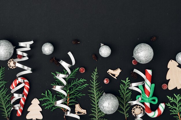 New Year's, festive decor on a black background. Copy space, flat lay, mock up, top view.