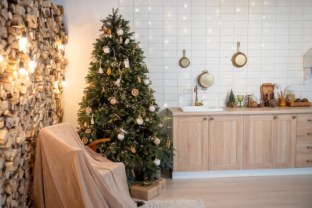 New Year's kitchen interior with a Christmas tree and a rocking chair