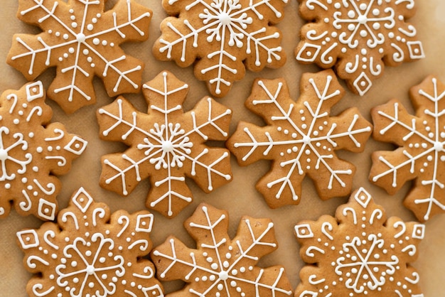 New Year's traditional gingerbread cookies decorated with sugar white icing closeup