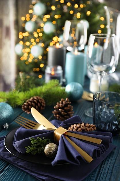 New Year table setting with bokeh on wooden table.