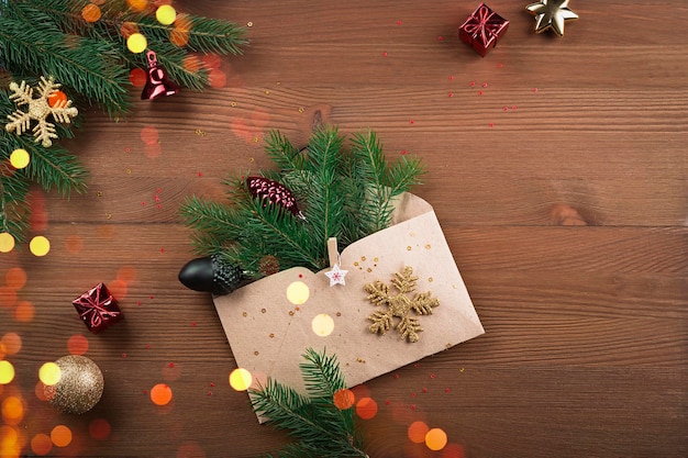 New Year trees and letter on a wooden background