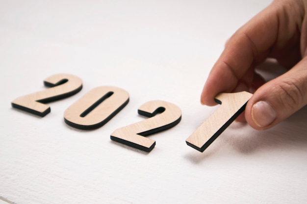 Photo new year wooden letters arranged by hand