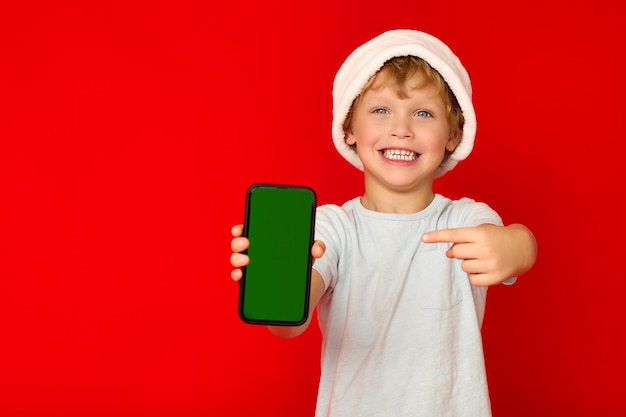 New Year39s discounts of mobile operators advertise a child in a Santa Claus hat