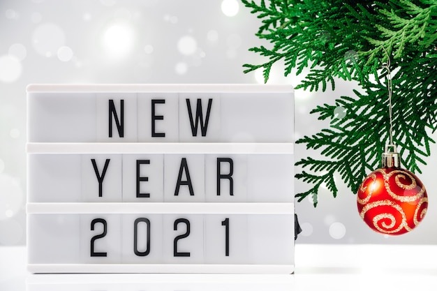 New Years concept 2021, christmas tree and text on white background.