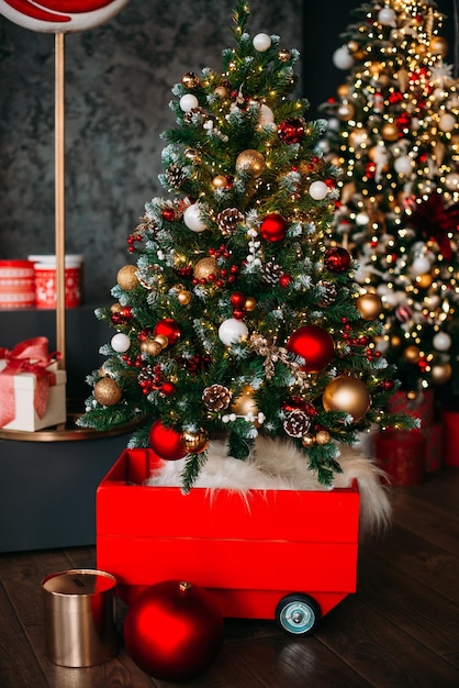 New Years decorations Christmas tree decorated with red and gold balls