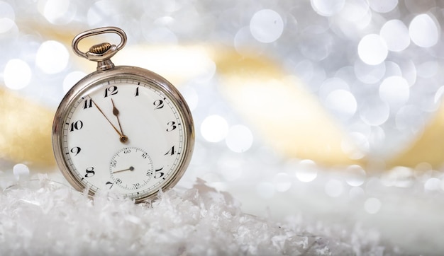 New Years eve Minutes to midnight on an old fashioned pocket watch