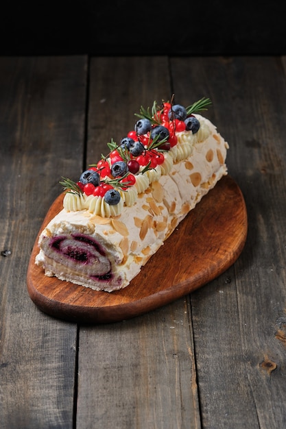 New Years meringue roll with strawberries blueberries raspberries and cranberries