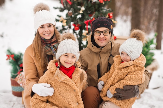 New Years postcard family photo with a Christmas tree in nature 3522